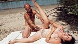 tattooed MILF gets surprised while sunbathing
